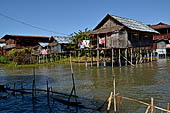 Inle Lake Myanmar. All the buildings are constructed on piles. Residents travel around by canoe, but there are also bamboo walkways and bridges over the canals, monasteries and stupas. 